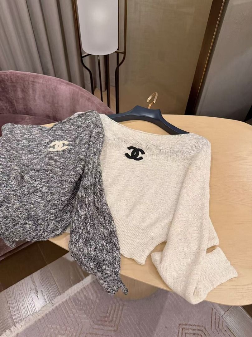 Chanel Knit Sweater Top with CC Logo (Category: Longsleeves) located in Quezon City. Submitted by vangjalaya37815 (Listing ID 1468583589, Image 1). Description: - Brand: Chanel - Style: Knit sweater top with embroidered CC logo, boat neck, long sleeves, and cropped fit - Material: Soft and lightweight knit - Colors available: Classic White and Heather Grey - Versatility: Easy to style with high-waisted jeans or skirts - Condition: Brand new / Exc