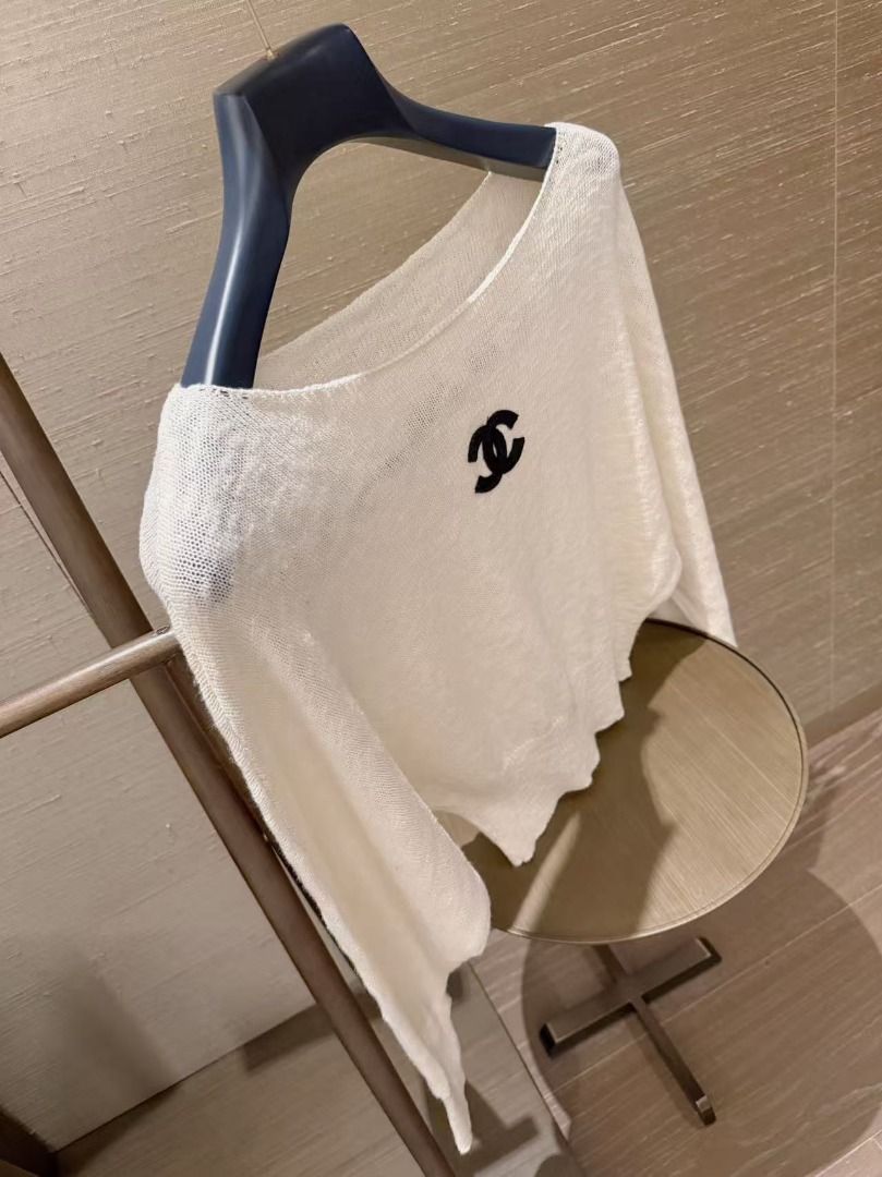 Chanel Knit Sweater Top with CC Logo (Category: Longsleeves) located in Quezon City. Submitted by vangjalaya37815 (Listing ID 1468583589, Image 3). Description: - Brand: Chanel - Style: Knit sweater top with embroidered CC logo, boat neck, long sleeves, and cropped fit - Material: Soft and lightweight knit - Colors available: Classic White and Heather Grey - Versatility: Easy to style with high-waisted jeans or skirts - Condition: Brand new / Exc