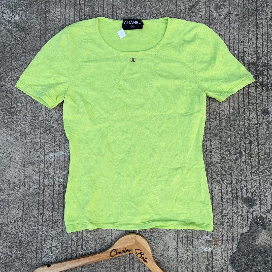 Chanel Lime Green Short Sleeve Knit Top (Category: Shirts) located in Davao. Submitted by charlesole52665 (Listing ID 1468555964, Image 1). Description: - Brand: Chanel - Item: Short sleeve knit top - Color: Lime green - Size: Tagged 38 (fits S-M) - Width: 15inch (stretchable) - Length: 21 inch - Details: Scoop neckline with metal CC logo charm, made in Italy - Material: Lightweight, stretch knit - Condition: Excellent, clean with no stains or pu