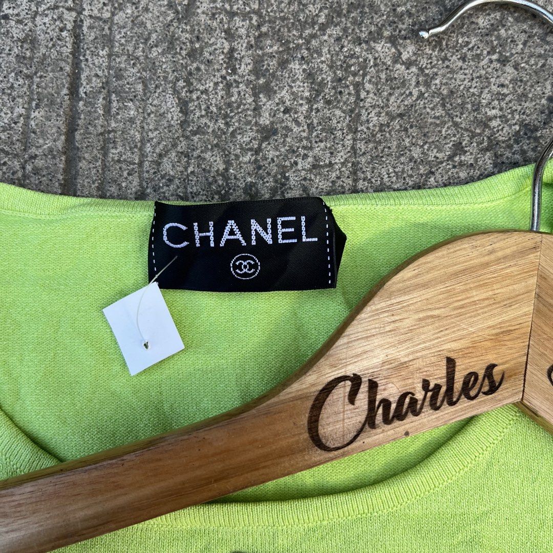 Chanel Lime Green Short Sleeve Knit Top (Category: Shirts) located in Davao. Submitted by charlesole52665 (Listing ID 1468555964, Image 3). Description: - Brand: Chanel - Item: Short sleeve knit top - Color: Lime green - Size: Tagged 38 (fits S-M) - Width: 15inch (stretchable) - Length: 21 inch - Details: Scoop neckline with metal CC logo charm, made in Italy - Material: Lightweight, stretch knit - Condition: Excellent, clean with no stains or pu