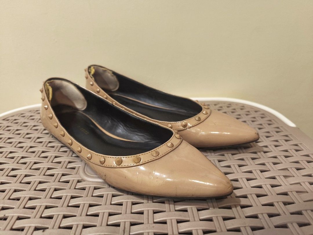 Charles & Keith Studded Nude Pointed Toe Flats (Category: Flats & Sandals) located in Baguio. Submitted by zia_zab (Listing ID 1468531407, Image 2). Description: - Brand: Charles & Keith - Style: Nude patent pointed toe flats with slip-on design and stud trim - Interior: Contrasting black inner lining - Condition: Visible scuffs on front toes, wear on inner heel lining, and normal wear on soles - Ideal for: Casual daily outfits and effortless sty