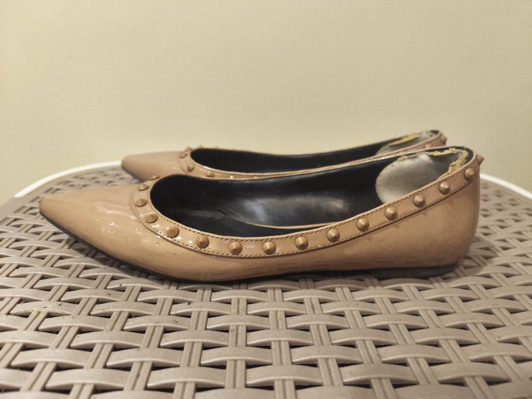Charles & Keith Studded Nude Pointed Toe Flats (Category: Flats & Sandals) located in Baguio. Submitted by zia_zab (Listing ID 1468531407, Image 3). Description: - Brand: Charles & Keith - Style: Nude patent pointed toe flats with slip-on design and stud trim - Interior: Contrasting black inner lining - Condition: Visible scuffs on front toes, wear on inner heel lining, and normal wear on soles - Ideal for: Casual daily outfits and effortless sty