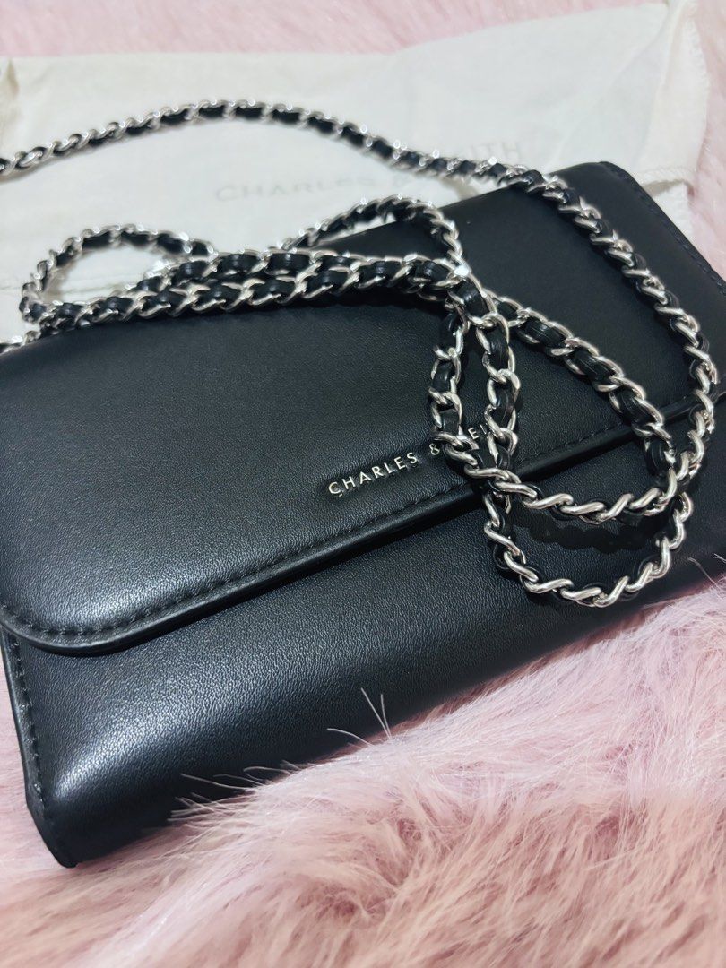 CHARLES & KEITH WALLET / SLING WALLET (Category: Wallets & Card holders) located in Manila. Submitted by keyttttt_keyttttt (Listing ID 1468534540, Image 1). Description: Looking for a stylish and practical wallet? This one’s for you! ✔️ Seldom used ✔️ With minimal flaws ✔️ Still presentable and usable Perfect for those who love a classy and versatile accessory. You can use it as a wallet or a sling wallet, making it a convenient option when you w