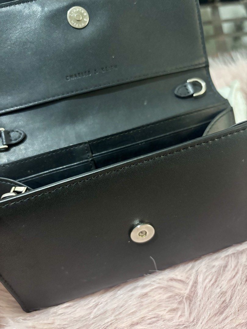 CHARLES & KEITH WALLET / SLING WALLET (Category: Wallets & Card holders) located in Manila. Submitted by keyttttt_keyttttt (Listing ID 1468534540, Image 2). Description: Looking for a stylish and practical wallet? This one’s for you! ✔️ Seldom used ✔️ With minimal flaws ✔️ Still presentable and usable Perfect for those who love a classy and versatile accessory. You can use it as a wallet or a sling wallet, making it a convenient option when you w