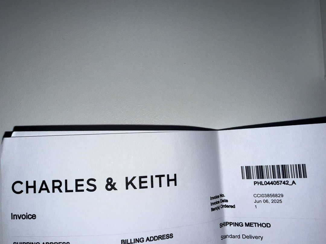 Charles & Keith White Card Holder with Chain (Category: Wallets & Card holders) located in Manila. Submitted by chi.declutter (Listing ID 1468517148, Image 3). Description: Bought at 1400 now selling for 1100 - Brand: Charles & Keith - Color: White with elegant gold hardware - Design: Quilted wave pattern at the bottom - Compartments: Zipper top compartment and multiple front card slots - Extras: Attached metal chain with lobster clasp clip - Inc