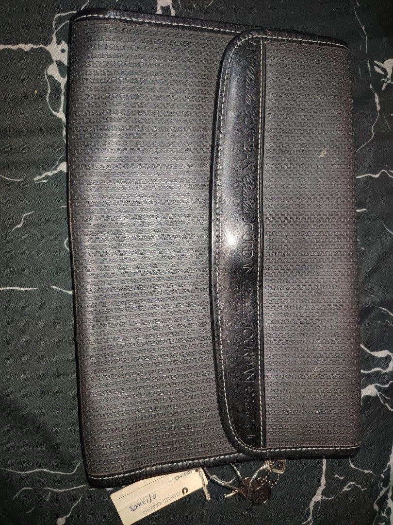 Charles Jourdan Actif Document Organiser (Category: Stationery & School Supplies) located in Manila. Submitted by chuaniki (Listing ID 1468709078, Image 2). Description: - Authentic Charles Jourdan Actif organiser from Paris - Classic monogram pattern printed on the exterior - Front flap closure featuring debossed branding - Convenient zip pocket on the back - Stylish hanging keys attached via chain - Grey fabric-lined interior with a zip pocket 