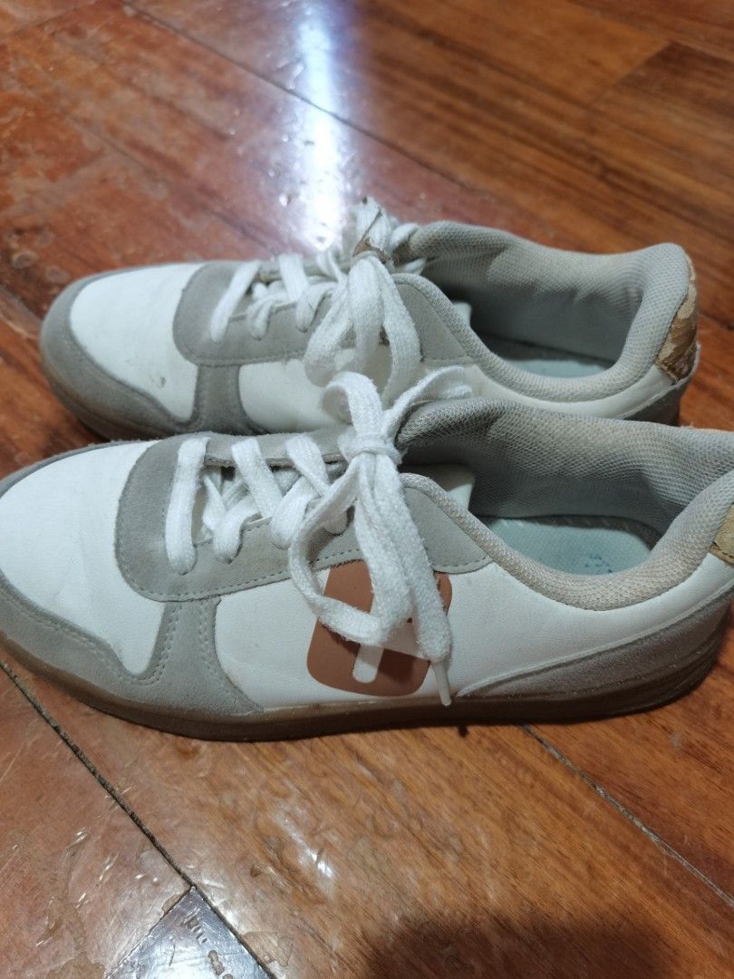 Chicco White and Grey Casual Sneakers (Category: Babies & Kids Fashion) located in Lucena. Submitted by jjbrandedcloset (Listing ID 1468572359, Image 2). Description: - Brand: Chicco - Color: White and grey with brown logo details - Material: Suede panels with white laces and durable gum soles - Condition: Pre-loved with minor scuffs on uppers and fading on insoles; easily cleaned with a quick wipe - Features: Padded collar for extra comfort.