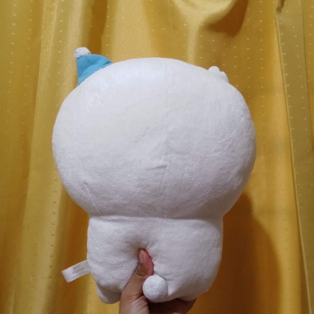 Chiikawa plush toy with small bear (Category: Plushies & Soft Toys) located in Quezon City. Submitted by trinket_cat (Listing ID 1468578384, Image 2). Description: - Character: Chiikawa holding a brown bear wearing a tiny blue hat - Condition: Brand new with side tag attached, super soft fabric, and clean surface - Storage: Kept safely away from dust in a smoke-free environment - Perfect for: Chiikawa fans and plush toy collectors.