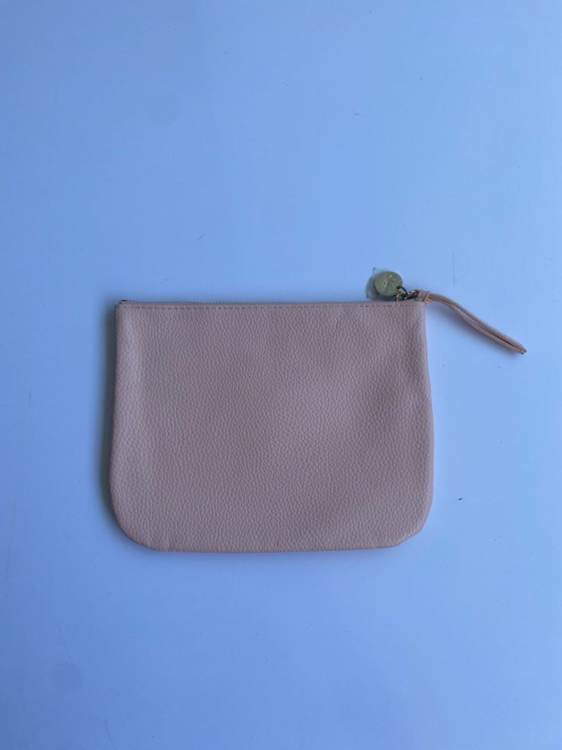 Chloé Parfum Pink Pouch Makeup Bag (Category: Purses & Pouches) located in Cavite. Submitted by benta_bounce (Listing ID 1468556928, Image 2). Description: - Authentic Chloé Parfum pink pouch - Features chic gold-tone hardware and debossed logo text on the front - Zipper closure with a matching pull tab and branded metal charm (protective plastic still attached) - Includes a convenient front pocket - Flaw note: Some peeling and cracking along the