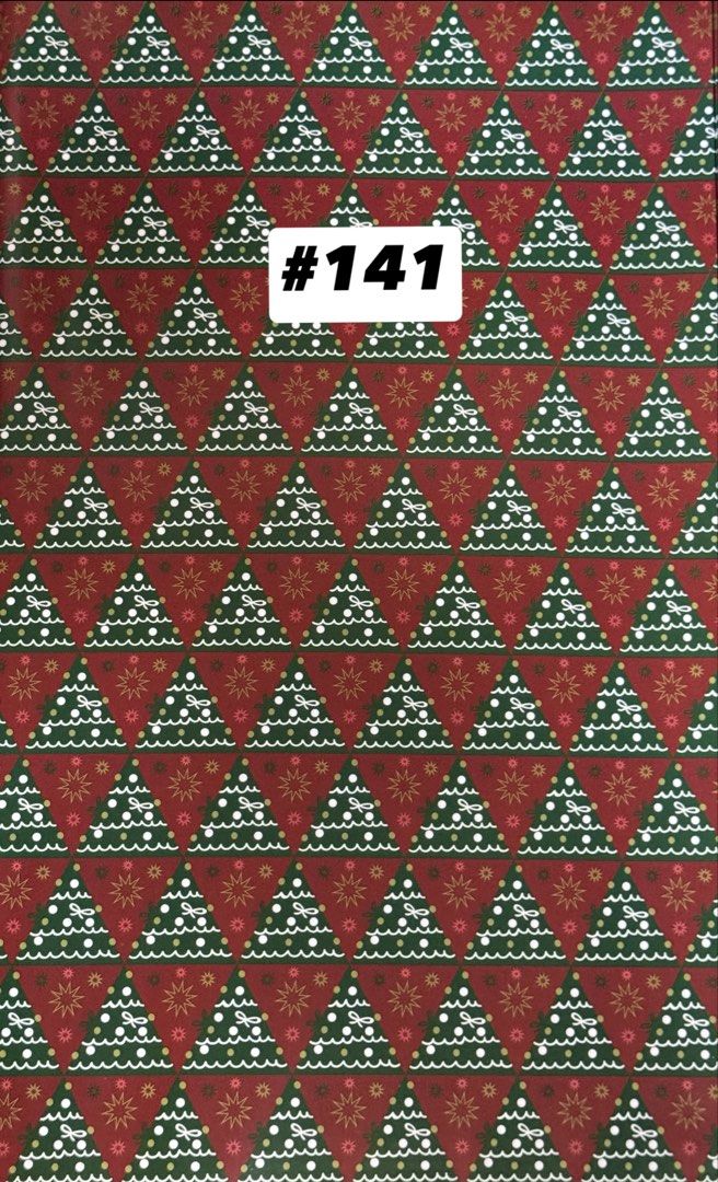 Christmas Holiday Wrapping Paper Assorted Designs (Category: Craft Supplies & Tools) located in Quezon City. Submitted by kryshnanzyanna (Listing ID 1468523023, Image 3). Description: - Brand new, unused Christmas wrapping paper - Features festive designs including trees, snowflakes, berries, and Merry Christmas text - Beautiful holiday color scheme: gold trees on white, classic red with script, and green trees - Ideal for holiday gift-giving and