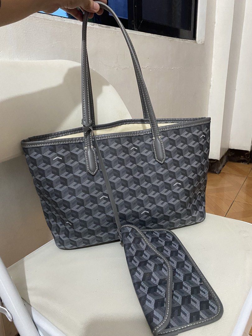 Christy ng grey tote bag (Category: Tote Bags) located in Pasig City. Submitted by avery4444 (Listing ID 1468708531, Image 3). Description: Good condition .