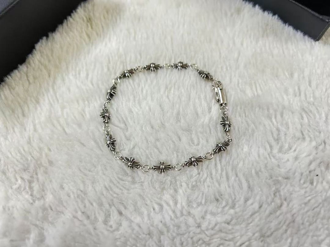 Chrome Hearts Tiny Cross Bracelet (Category: Bracelets) located in Quezon City. Submitted by grossoimor01025 (Listing ID 1468587099, Image 1). Description: - Material/Style: Classic gothic silver bracelet with delicate cross charms all around - Closure: Secure box clasp for worry-free wear - Inclusions: Comes complete with a branded black presentation box and velvet pouch - Condition: Stored carefully inside its box when not worn, excellent every