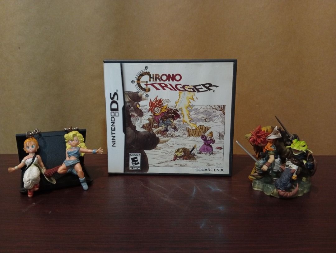 Chrono Trigger Nintendo DS Game with Case (Category: Nintendo) located in Quezon City. Submitted by bargainbayan (Listing ID 1468514019, Image 1). Description: FOR SALE/FOR TRADE: Chrono Trigger DS and Figures Price: Chrono Trigger DS - 6,200 Crono and Frog (Formation Arts) [ULTRA RARE] - 4,500 Marle & Ayla Keychain Set - 900 for both *Can be traded to Magic: The Gathering Cards Description/Condition: Chrono Trigger DS: - Rare - Comes with manual