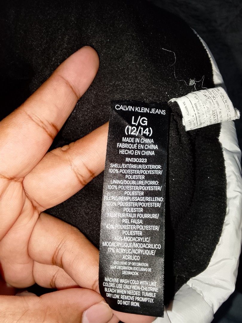 CK Puffer Jacket (Category: Coats, Jackets and Outerwear) located in Dasmarinas. Submitted by alexander24 (Listing ID 1468700370, Image 3). Description: Calvin Klein Puffer Jacket Size: Large women's Dimes: W18 x L26 Condition: Excellent Color rate: 9.8/10 Issue: minimal scratch & rust stain.