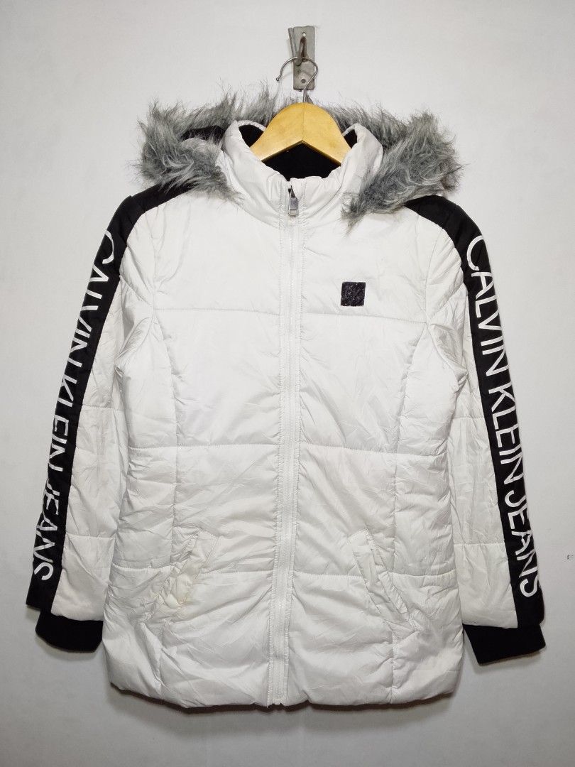 CK Puffer Jacket (Category: Coats, Jackets and Outerwear) located in Dasmarinas. Submitted by alexander24 (Listing ID 1468700370, Image 1). Description: Calvin Klein Puffer Jacket Size: Large women's Dimes: W18 x L26 Condition: Excellent Color rate: 9.8/10 Issue: minimal scratch & rust stain.