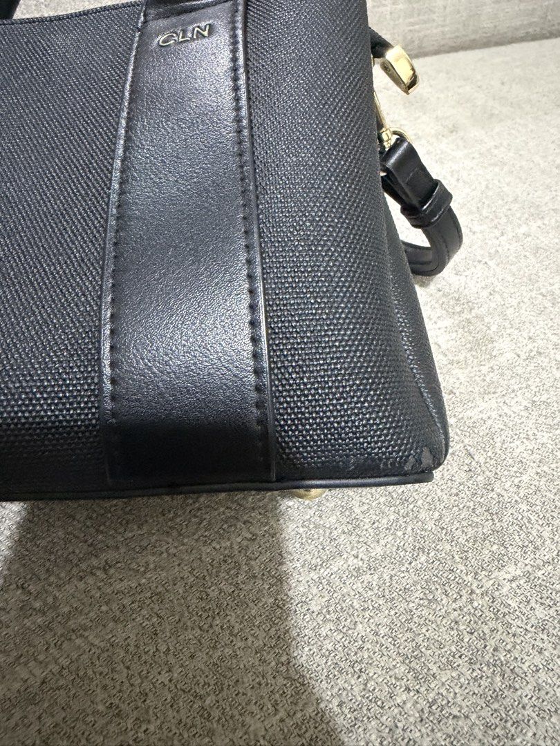 CLN Handbag with Strap (Category: Shoulder Bags) located in Pasig City. Submitted by lo_pernz (Listing ID 1468580669, Image 3). Description: Good as new Minor flaws but barely noticeable - Exterior of the bag (two small rips in the corner of bag - refer to the 3rd and 4th pictures) - A grayish scrape in the fabric - interior of the bag (5th pic).