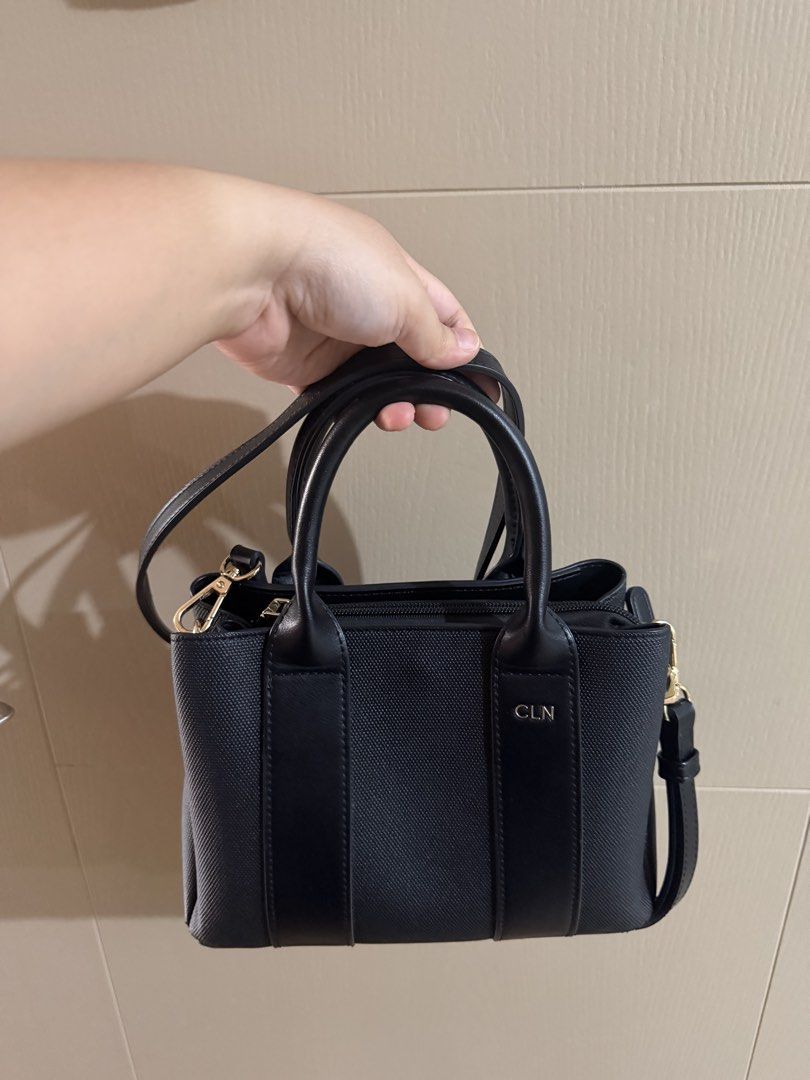 CLN Handbag with Strap (Category: Shoulder Bags) located in Pasig City. Submitted by lo_pernz (Listing ID 1468580669, Image 2). Description: Good as new Minor flaws but barely noticeable - Exterior of the bag (two small rips in the corner of bag - refer to the 3rd and 4th pictures) - A grayish scrape in the fabric - interior of the bag (5th pic).