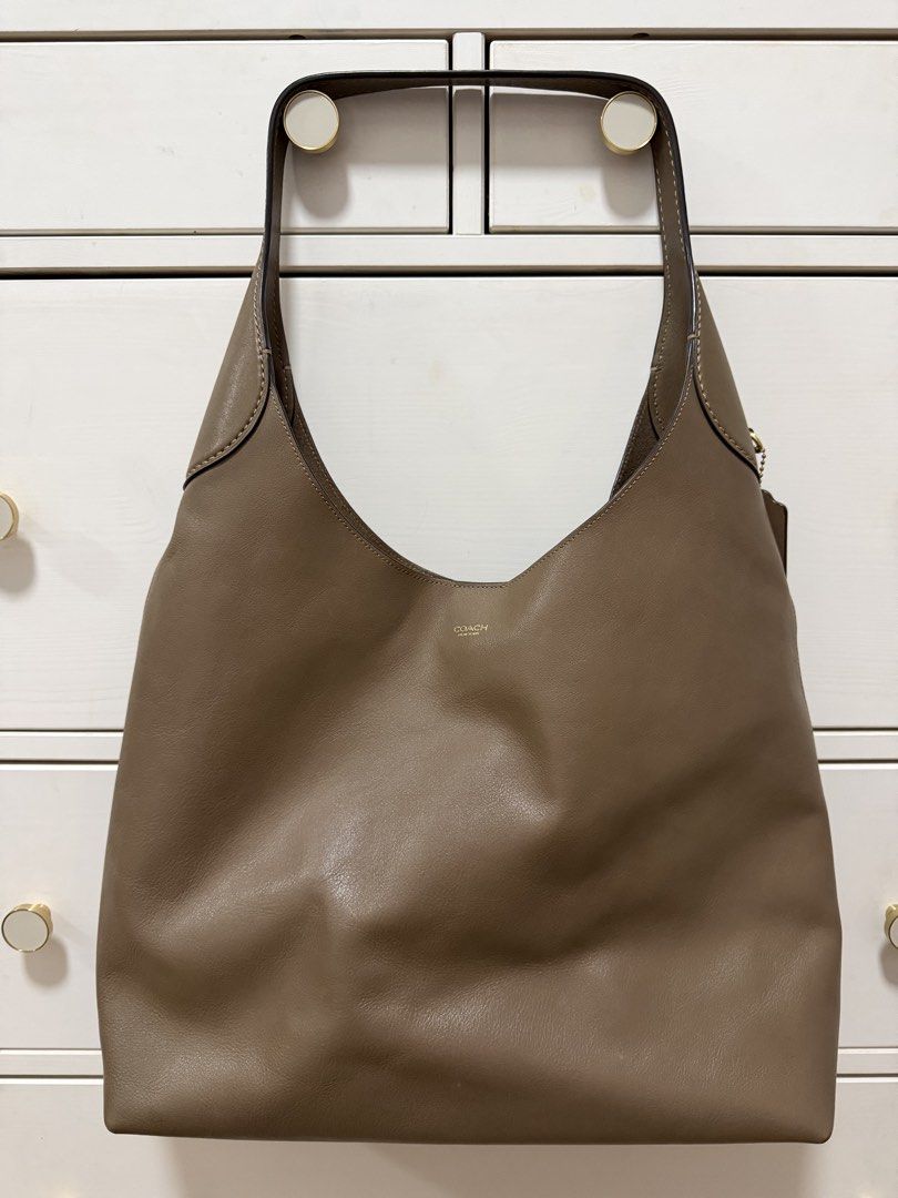 Coach Brooklyn Shoulder Bag 39 (Category: Shoulder Bags) located in Taguig. Submitted by riacalleja1 (Listing ID 1468589092, Image 1). Description: Condition: Very good pre-owned condition * Supple leather with natural creasing from use * Exterior is well maintained, with no obvious major scratches, cracks or peeling * Bag has softened over time and is noticeably slouchier and less structured than when new * Interior is generally clean, with ligh