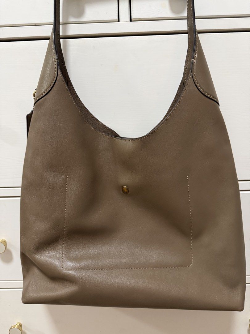 Coach Brooklyn Shoulder Bag 39 (Category: Shoulder Bags) located in Taguig. Submitted by riacalleja1 (Listing ID 1468589092, Image 2). Description: Condition: Very good pre-owned condition * Supple leather with natural creasing from use * Exterior is well maintained, with no obvious major scratches, cracks or peeling * Bag has softened over time and is noticeably slouchier and less structured than when new * Interior is generally clean, with ligh