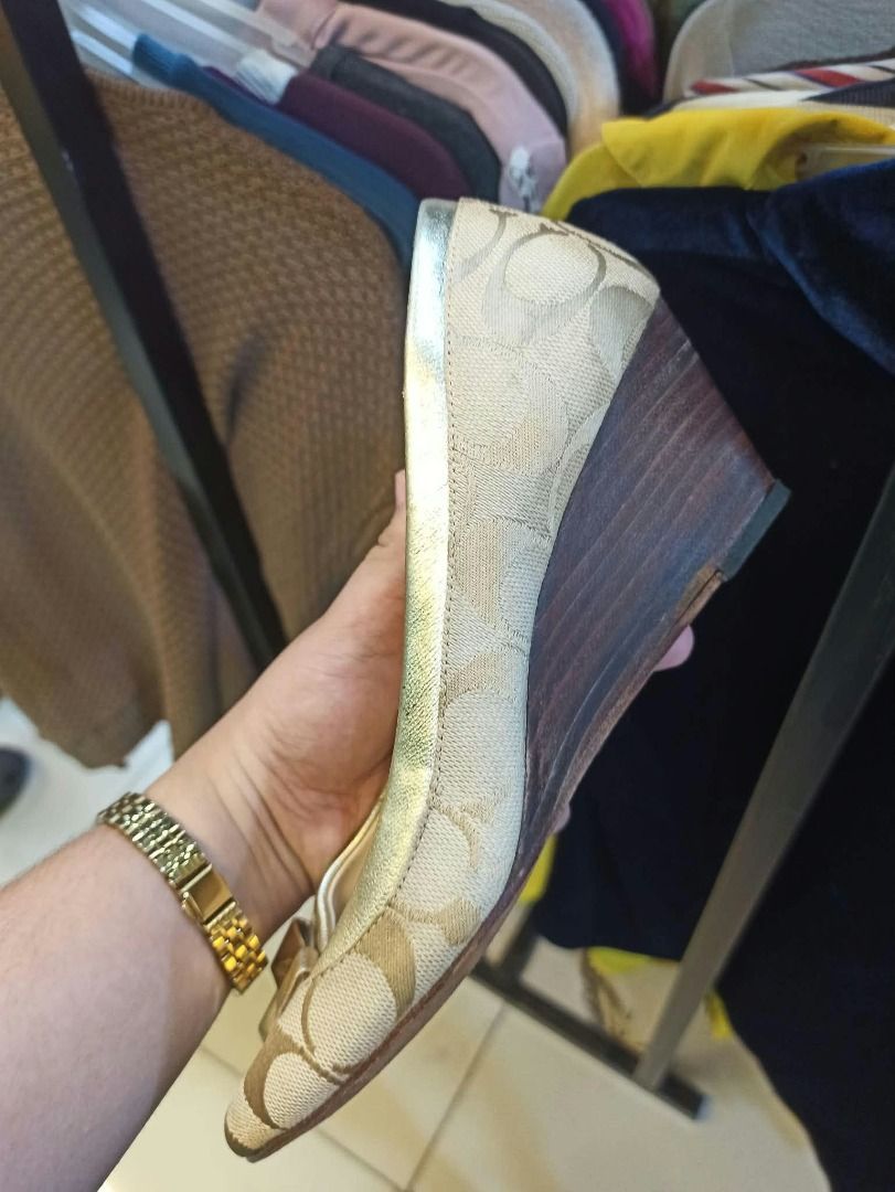 Coach cream & tan wedge heels (Category: Wedges) located in Quezon City. Submitted by annethriftsph (Listing ID 1468598957, Image 2). Description: with beige fabric and repeating beige C logo pattern, .