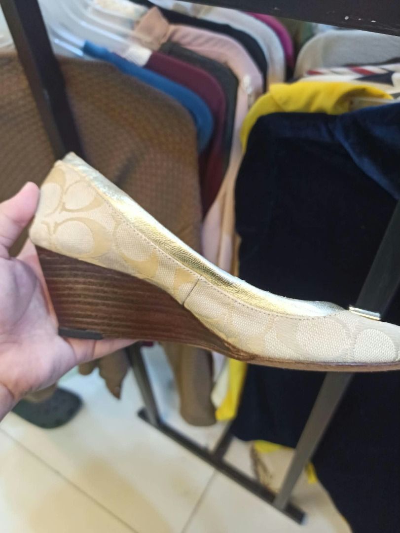 Coach cream & tan wedge heels (Category: Wedges) located in Quezon City. Submitted by annethriftsph (Listing ID 1468598957, Image 1). Description: with beige fabric and repeating beige C logo pattern, .