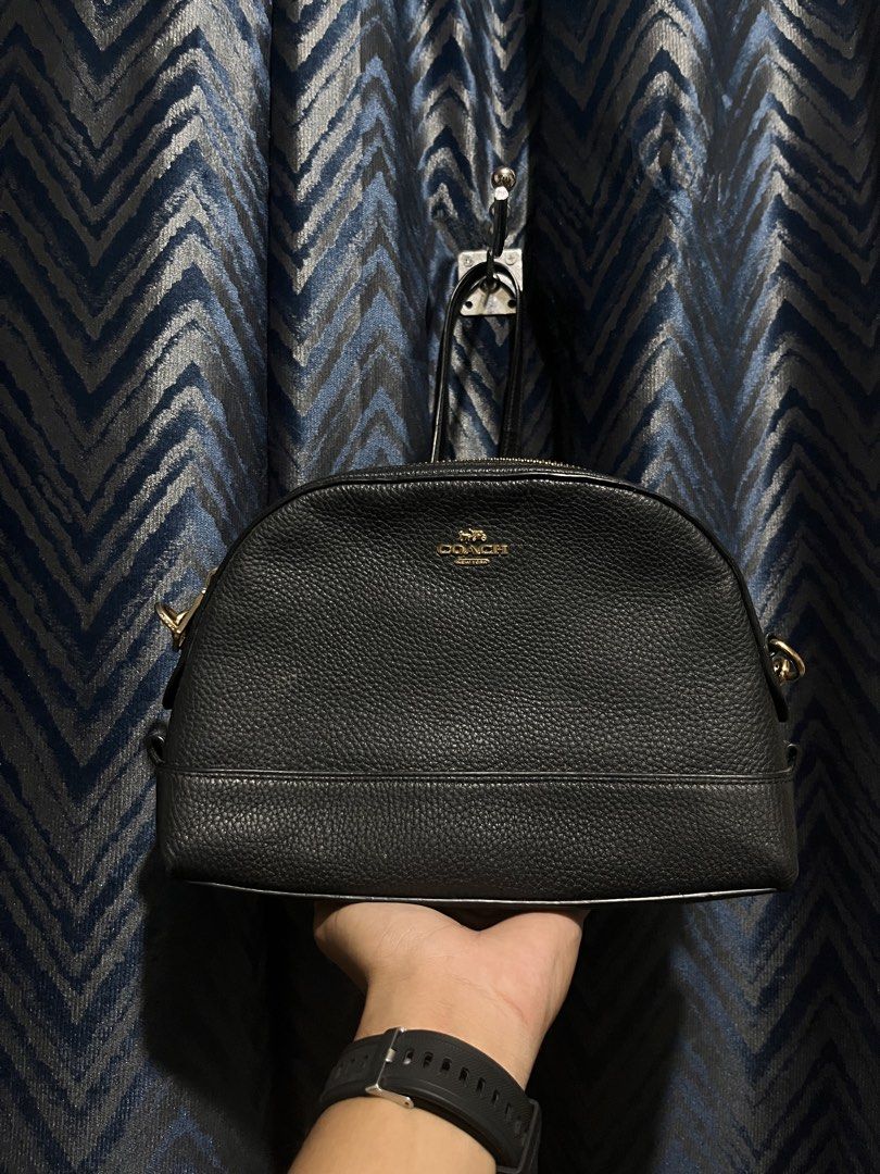 Coach Cross body Dome bag (Category: Luxury Bags & Wallets) located in Lopez. Submitted by goldenbird-0985 (Listing ID 1468634756, Image 1). Description: No issue on leather Only issue is minimal Brass fadings Still at a prestine condition.