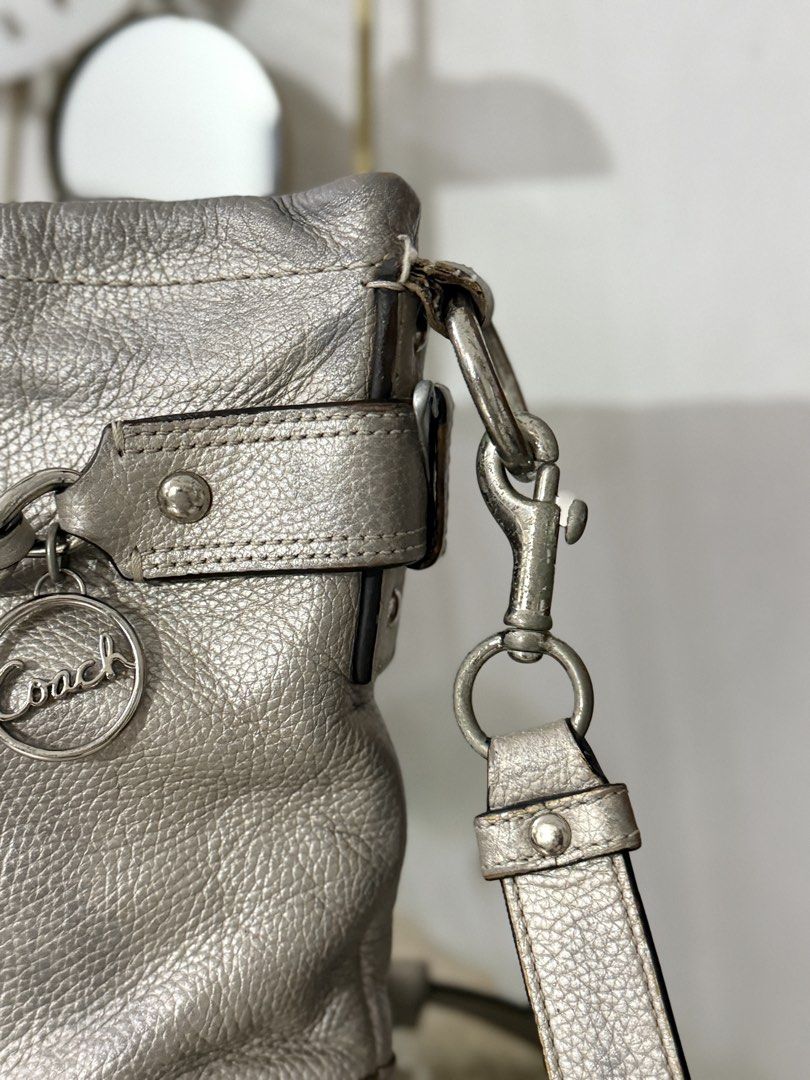 Coach Metallic Chain Crossbody (Category: Luxury Bags & Wallets) located in Cainta. Submitted by angellyy_ (Listing ID 1468686105, Image 2). Description: Coach Metallic Silver Chain Crossbody Pebbled Leather Well used With signs of wear, discoloration, leather and rubber lining issues. No holes See pictures to see flaws.
