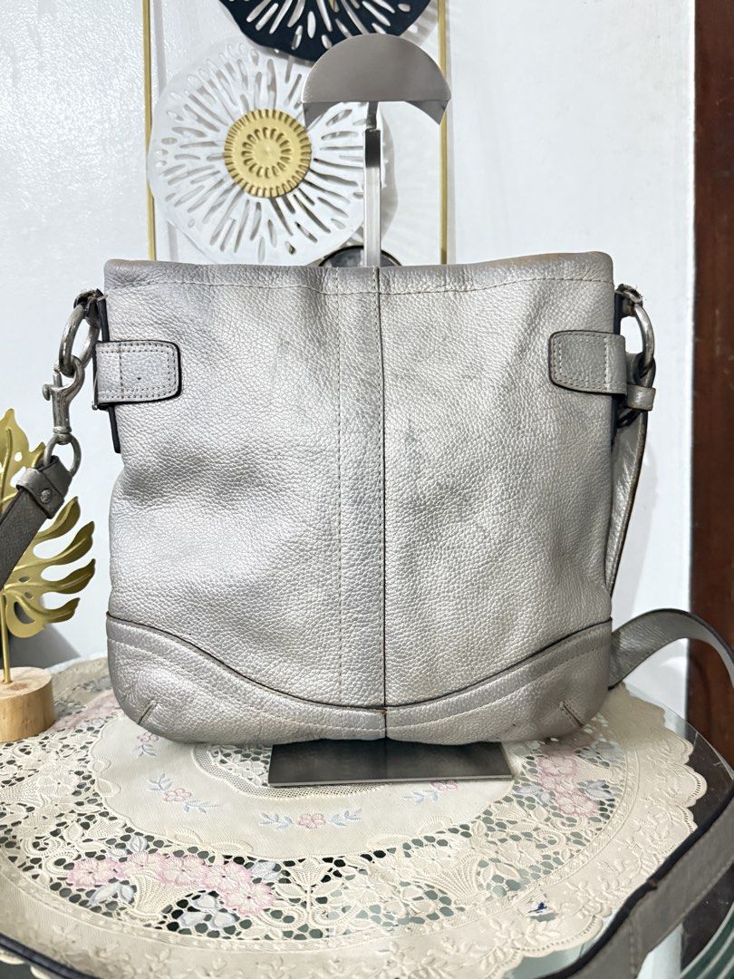 Coach Metallic Chain Crossbody (Category: Luxury Bags & Wallets) located in Cainta. Submitted by angellyy_ (Listing ID 1468686105, Image 3). Description: Coach Metallic Silver Chain Crossbody Pebbled Leather Well used With signs of wear, discoloration, leather and rubber lining issues. No holes See pictures to see flaws.