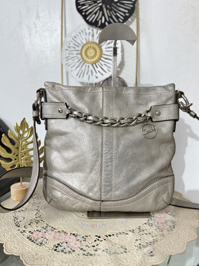 Coach Metallic Chain Crossbody (Category: Luxury Bags & Wallets) located in Cainta. Submitted by angellyy_ (Listing ID 1468686105, Image 1). Description: Coach Metallic Silver Chain Crossbody Pebbled Leather Well used With signs of wear, discoloration, leather and rubber lining issues. No holes See pictures to see flaws.