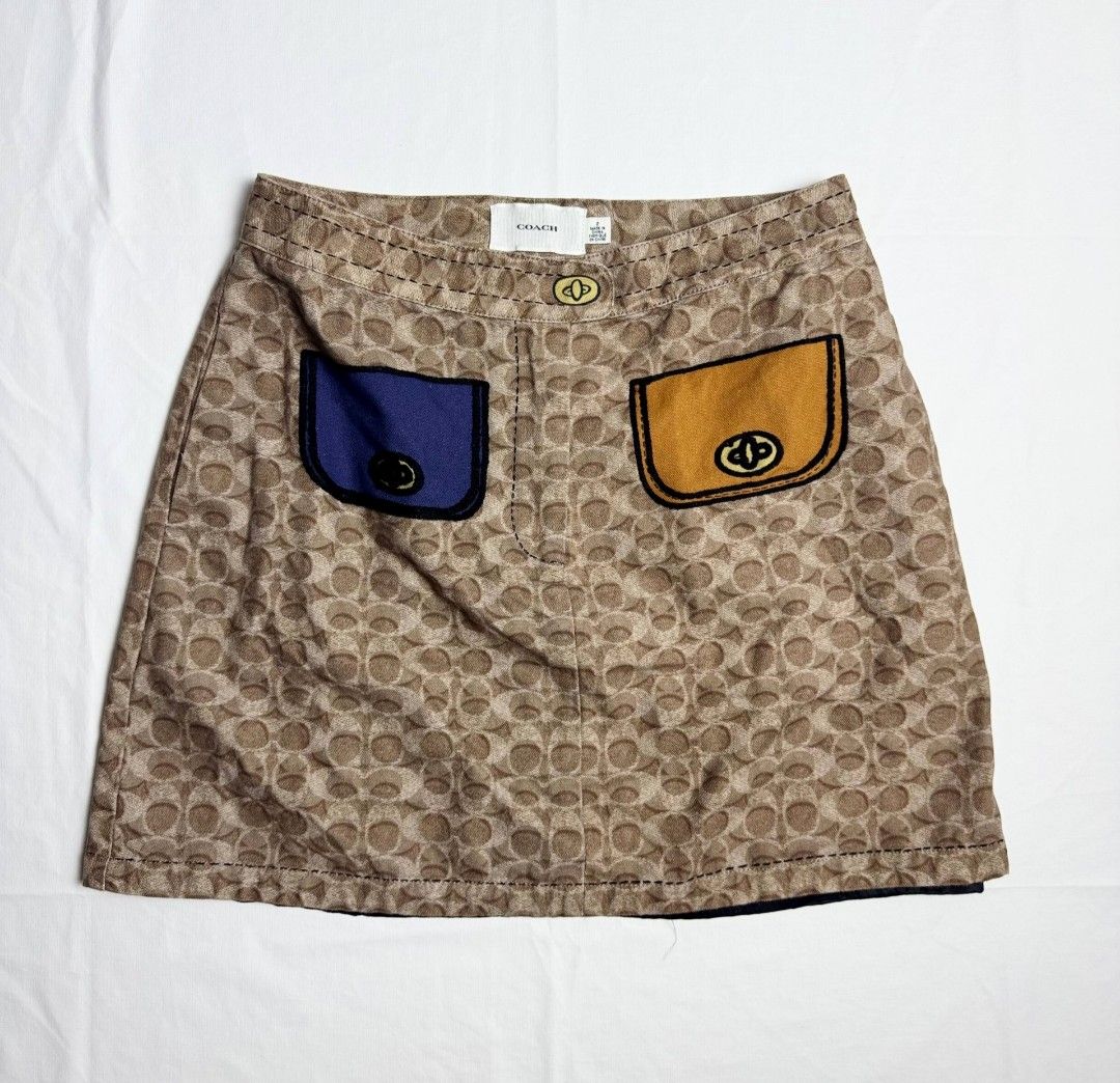 Coach monogram trompe lo'eil skirt (Category: Skirts) located in Cavite. Submitted by goinguppp (Listing ID 1468560328, Image 2). Description: Coach monogram skirt Size 2 like new.
