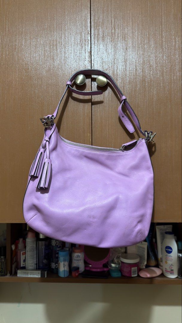 COACH PINK/PURPLE BAG (Category: Shoulder Bags) located in Manila. Submitted by urban-vintage_2 (Listing ID 1468618321, Image 2). Description: ISSUE: SEE THE PICS FOR ISSUE (NEED WASH) MOP :GCASH (NO COD) SHIP VIA: LALAMOVE & J&T LOCATION: PASIG CITY INCLUDES LONGSTRAP / CHARM .