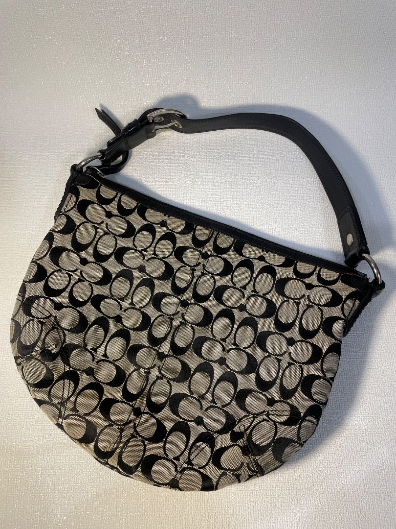 Coach Soho Signature Jacquard Medium Hobo (Category: Luxury Bags & Wallets) located in Manila. Submitted by tshoponline (Listing ID 1468299572, Image 1). Description: Black and white Coach signature C jacquard shoulder bag. Black leather strap with silver hardware buckle. Zip top closure. Clean fabric lining inside. Classic y2k style hobo purse, spacious enough for daily essentials. Coach Soho Signature Jacquard Medium Hobo •2008 - Style no. F131