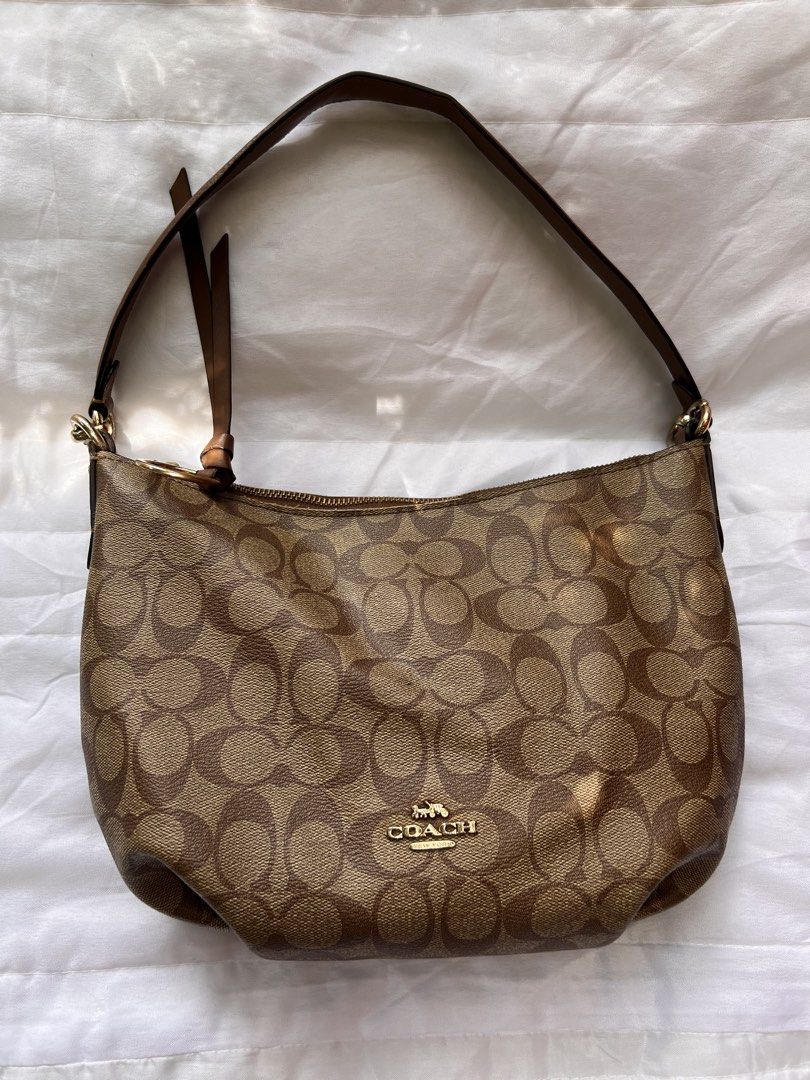 Coach Signature Monogram Hobo Shoulder Bag (Category: Luxury Bags & Wallets) located in Quezon City. Submitted by rizza14ortiz (Listing ID 1468527485, Image 1). Description: - Authentic Coach hobo shoulder bag in classic brown signature monogram coated canvas - Elegant gold-tone hardware accents throughout - Secure zippered top closure plus a convenient extra zip pocket on the back - Comfortable single brown leather shoulder strap with chic golde