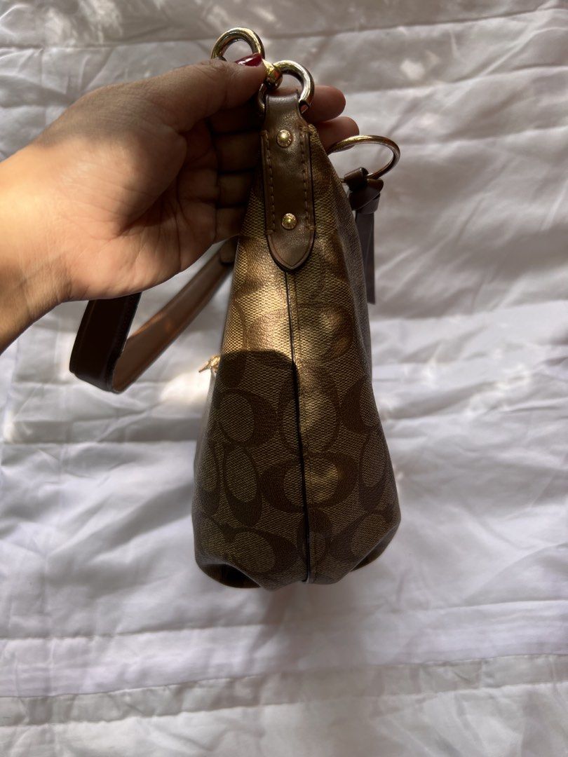 Coach Signature Monogram Hobo Shoulder Bag (Category: Luxury Bags & Wallets) located in Quezon City. Submitted by rizza14ortiz (Listing ID 1468527485, Image 2). Description: - Authentic Coach hobo shoulder bag in classic brown signature monogram coated canvas - Elegant gold-tone hardware accents throughout - Secure zippered top closure plus a convenient extra zip pocket on the back - Comfortable single brown leather shoulder strap with chic golde