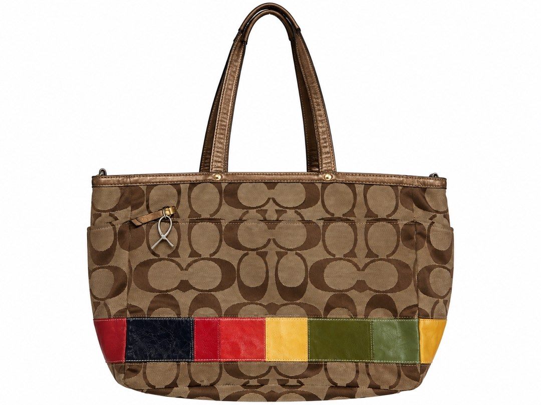 Coach Signature Stripe Patchwork Tote Bag (Category: Tote Bags) located in Manila. Submitted by happywind_ba7b96 (Listing ID 1468529119, Image 2). Description: - Authentic Coach signature C canvas tote bag - Eye-catching multi-color patent leather bottom stripes - Stylish metallic bronze leather handles and matching hangtag - Luxurious navy blue satin lining with zipper and slip compartments - Elegant gold-tone hardware details - Spacious design 