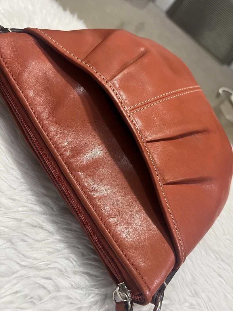 Coach Sling Bag (Category: Cross-body Bags) located in General Trias. Submitted by mybag2025 (Listing ID 1468649984, Image 2). Description: Red orange color Fits phone.