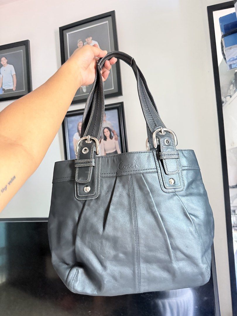 Coach Soho tote Leather Shoulder Bag (Category: Luxury Bags & Wallets) located in Taguig. Submitted by xylasprelovedbag (Listing ID 1468608448, Image 1). Description: - Authentic Coach leather shoulder bag in dark grey - Classic slouchy silhouette with stylish pleated front detailing - Dual shoulder straps with silver-tone buckles and contrast white stitching - Secure top zipper closure to keep your essentials safe - Spacious interior that easily