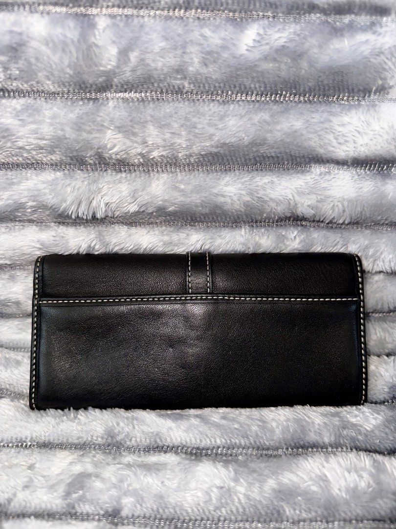 Coach Soho Wallet (Category: Wallets & Card holders) located in Bacoor. Submitted by jianne_preloved (Listing ID 1468519135, Image 2). Description: Selling my Coach Soho eyeglass case/long wallet. Price is slightly negotiable, but no lowball offers please. Serious buyers only 🤗 ✨ ITEM DETAILS: • Brand: Coach • Color/Hardware: Black w/ silver hardware • Material: Genuine leather • Condition: Like New - No flaws 🔎 CONDITION NOTES: • Exterior: Cle