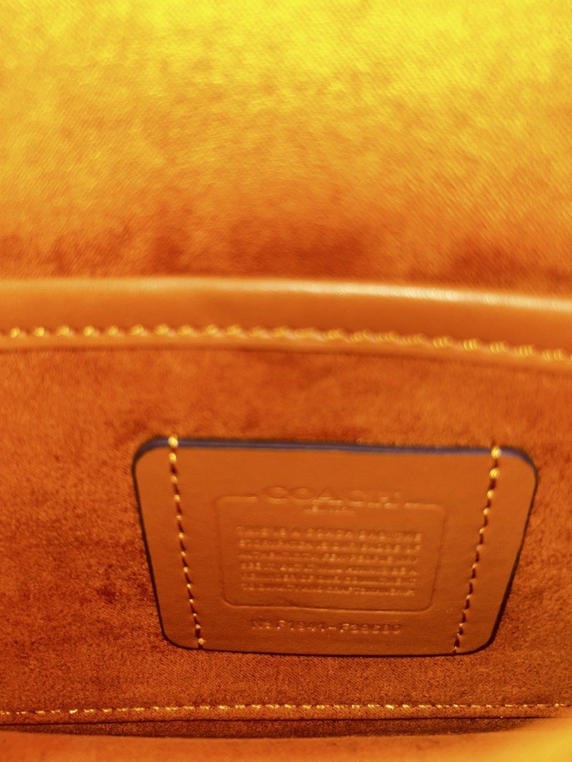 Coach Tabby Shoulder Bag White (Category: Luxury Bags & Wallets) located in Manila. Submitted by livedog-d301 (Listing ID 1468650261, Image 2). Description: - Authentic Coach Tabby shoulder bag in versatile white leather - Elegant gold-tone hardware with signature C clasp closure - Comes with an adjustable and removable strap for versatile styling - Clean suede-lined interior featuring a handy slip pocket and creed patch - Condition: Normal signs