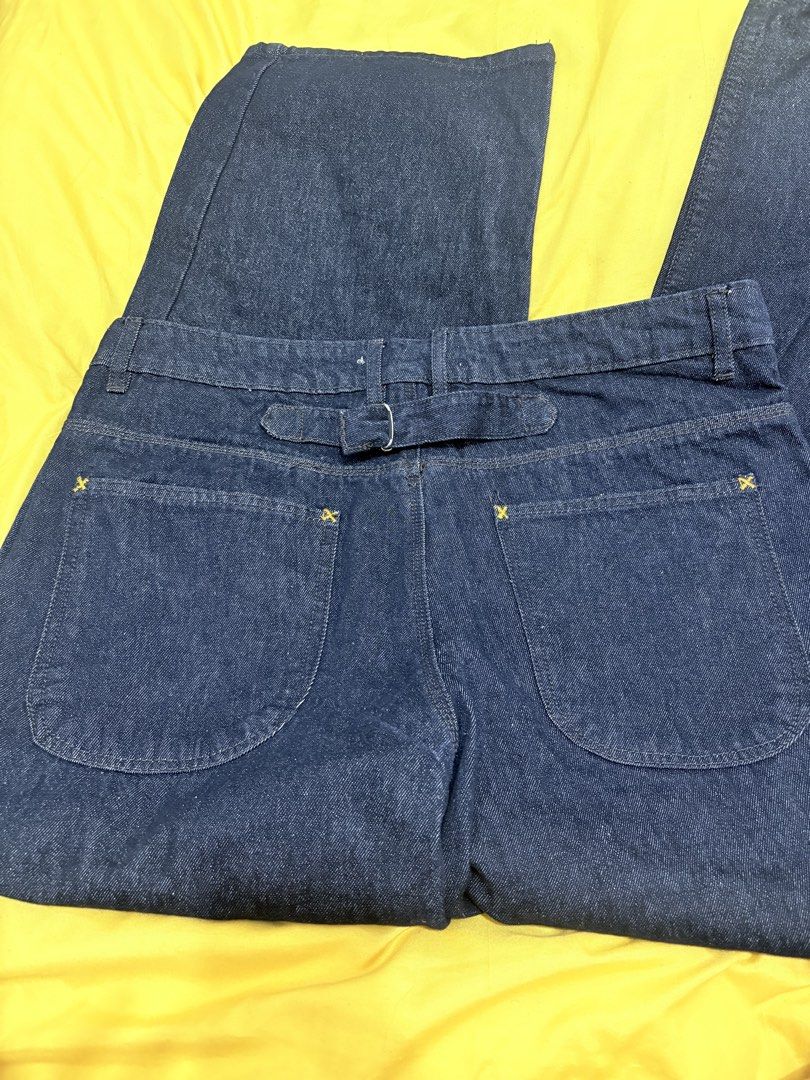 Code Blue Denimwear Dark Wash Jeans (Category: Jeans) located in Muntinlupa City. Submitted by closetfinds_ph_952 (Listing ID 1468687409, Image 3). Description: - Brand: Code Blue - Barrel Pants for Men - Size: 34 waist - Wash: Dark indigo / dark wash denim - Details: Workwear style front and back patch pockets - Feature: Cinch back strap with metal buckle - Stitching: Contrasting yellow stitch details - Closure: Button fly - Fabric: Denim - Used