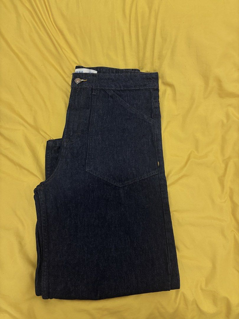 Code Blue Denimwear Dark Wash Jeans (Category: Jeans) located in Muntinlupa City. Submitted by closetfinds_ph_952 (Listing ID 1468687409, Image 1). Description: - Brand: Code Blue - Barrel Pants for Men - Size: 34 waist - Wash: Dark indigo / dark wash denim - Details: Workwear style front and back patch pockets - Feature: Cinch back strap with metal buckle - Stitching: Contrasting yellow stitch details - Closure: Button fly - Fabric: Denim - Used