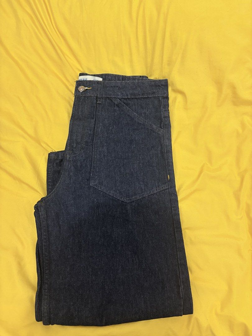 Code Blue Denimwear Dark Wash Jeans (Category: Jeans) located in Muntinlupa City. Submitted by closetfinds_ph_952 (Listing ID 1468687409, Image 2). Description: - Brand: Code Blue - Barrel Pants for Men - Size: 34 waist - Wash: Dark indigo / dark wash denim - Details: Workwear style front and back patch pockets - Feature: Cinch back strap with metal buckle - Stitching: Contrasting yellow stitch details - Closure: Button fly - Fabric: Denim - Used