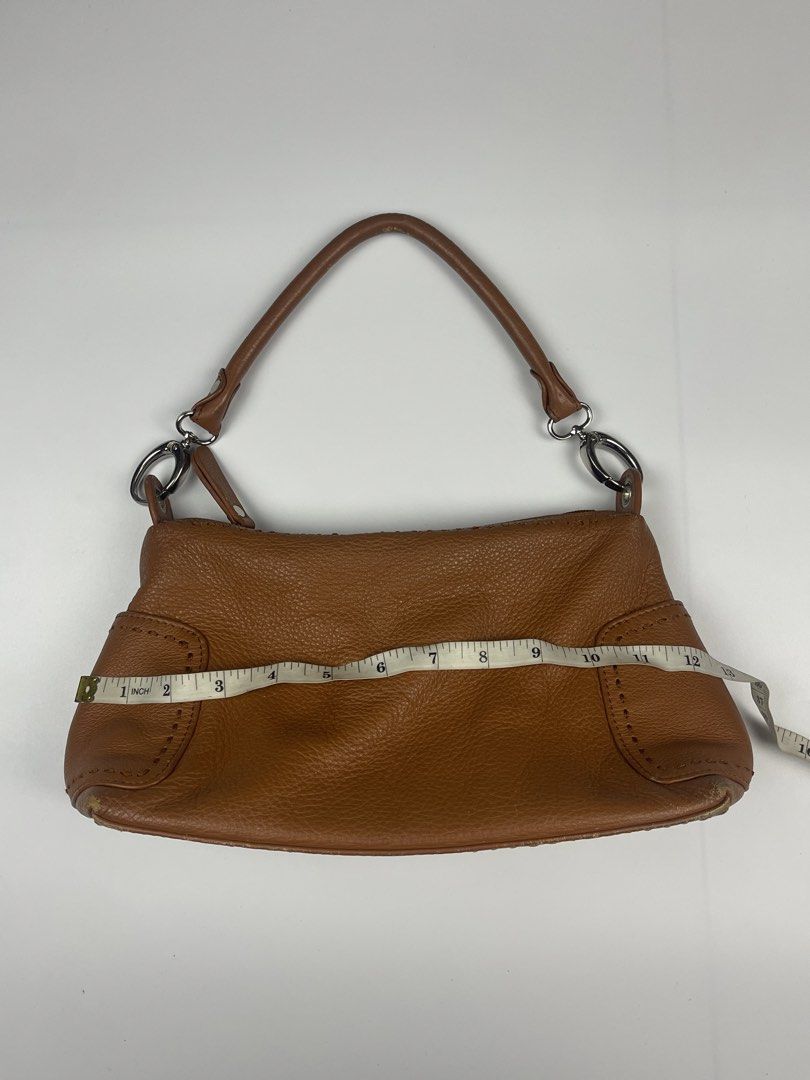 COGNAC BROWN PEBBLED LEATHER SHOULDER BAG (Category: Shoulder Bags) located in Cagayan de Oro. Submitted by kmcurations (Listing ID 1468544787, Image 2). Description: COGNAC BROWN PEBBLED LEATHER SHOULDER BAG Details & Dimensions: • Material: Pebbled / Grained Leather in Tan / Cognac Brown • Interior: Brown textile fabric lining with 1 zip compartment & slip wall pockets • Hardware: Silver-tone rings & metallic zip puller • Closure: Top zip closu