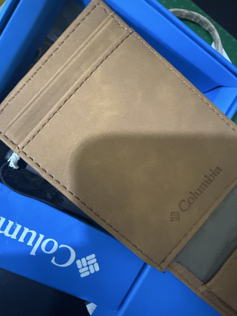 Columbia Brown Leather Tri-Fold Wallet in Box (Category: Wallets & Card Holders) located in Quezon City. Submitted by jvr2019 (Listing ID 1468599986, Image 3). Description: - Brand: Columbia - Material: Genuine Leather - Color: Light Brown - Design: Tri-fold with front zig-zag stitch accents and embossed logo - Inclusions: Comes with original blue packaging box - Condition: Brand new / Great for daily use.