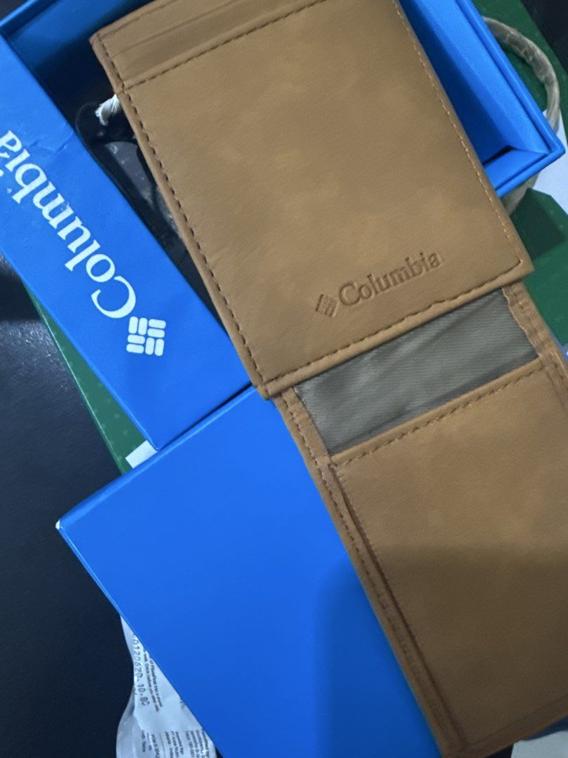 Columbia Brown Leather Tri-Fold Wallet in Box (Category: Wallets & Card Holders) located in Quezon City. Submitted by jvr2019 (Listing ID 1468599986, Image 2). Description: - Brand: Columbia - Material: Genuine Leather - Color: Light Brown - Design: Tri-fold with front zig-zag stitch accents and embossed logo - Inclusions: Comes with original blue packaging box - Condition: Brand new / Great for daily use.
