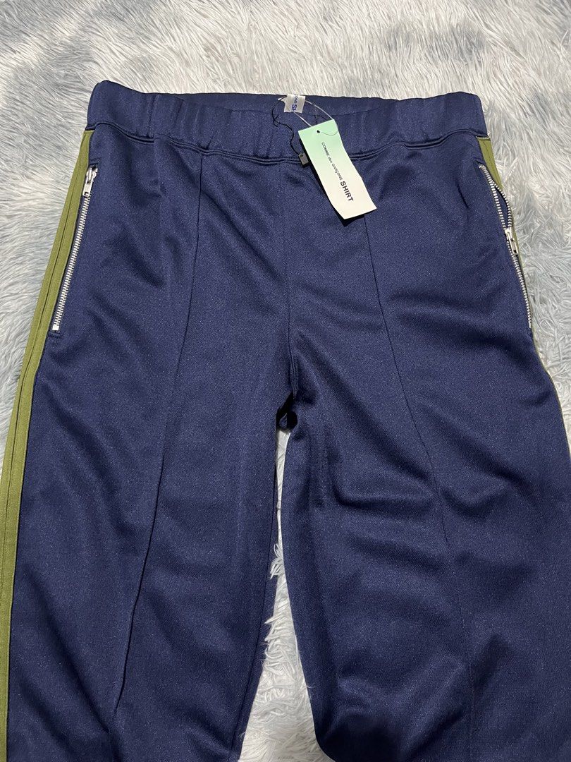 COMME des GARCONS Side Stripe Track Pants (Category: Joggers) located in Sasmuan (Sexmoan). Submitted by winterclothes.ph (Listing ID 1468518653, Image 2). Description: COMME des GARCONS Side Stripe Track Pants S on tag Waist 30-34 Length 33 Leg Opening 6.5 Excellent Condition.