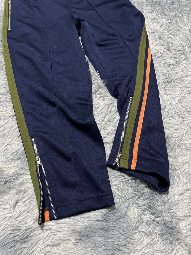COMME des GARCONS Side Stripe Track Pants (Category: Joggers) located in Sasmuan (Sexmoan). Submitted by winterclothes.ph (Listing ID 1468518653, Image 3). Description: COMME des GARCONS Side Stripe Track Pants S on tag Waist 30-34 Length 33 Leg Opening 6.5 Excellent Condition.