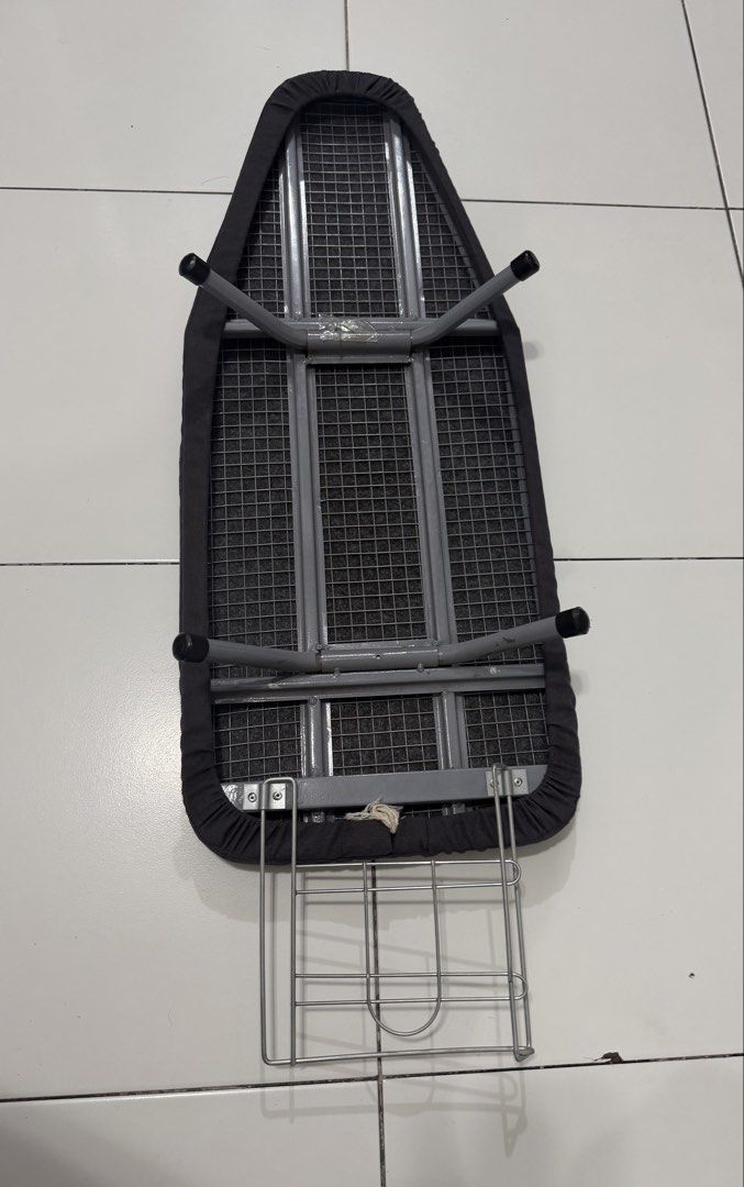 Compact Tabletop Ironing Board with Dark Grey Cover (Category: Irons & Steamers) located in Pasig City. Submitted by dstarcloset (Listing ID 1468708338, Image 3). Description: - Bought from Ace Hardware - Compact tabletop design, perfect for small apartments and dorms - Sturdy mesh steel top with a stylish, removable dark grey fabric cover - Built-in metal wire iron rest for added convenience - Collapsible metal legs fold completely flat for easy