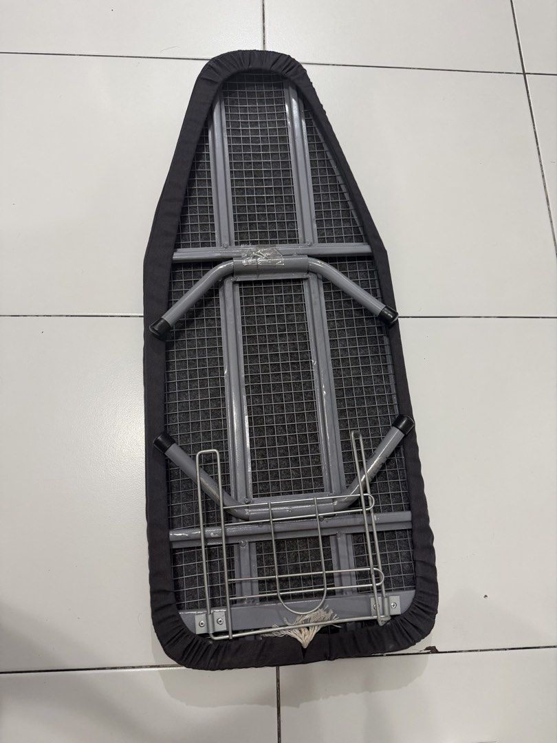 Compact Tabletop Ironing Board with Dark Grey Cover (Category: Irons & Steamers) located in Pasig City. Submitted by dstarcloset (Listing ID 1468708338, Image 2). Description: - Bought from Ace Hardware - Compact tabletop design, perfect for small apartments and dorms - Sturdy mesh steel top with a stylish, removable dark grey fabric cover - Built-in metal wire iron rest for added convenience - Collapsible metal legs fold completely flat for easy