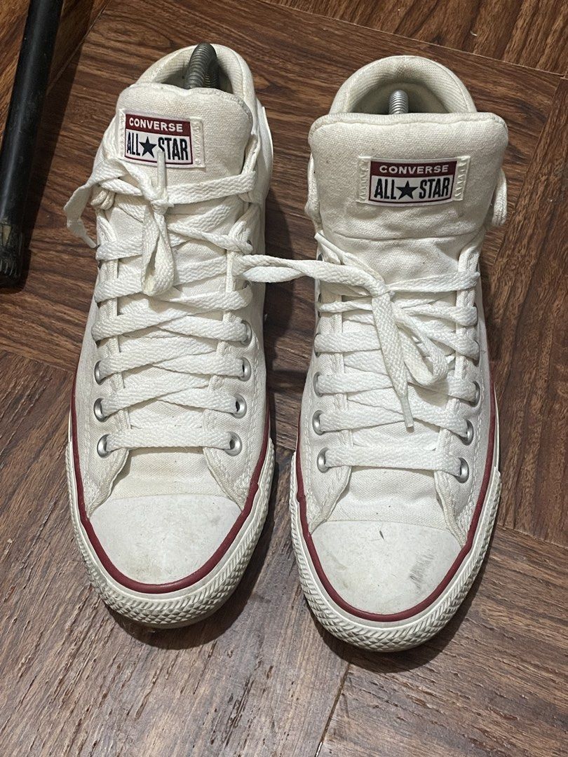 Converse All Star Mid Top White Size 42 (Category: Sneakers) located in Quezon City. Submitted by tindahanniblue (Listing ID 1468662688, Image 2). Description: - Brand: Converse All Star - Style: High top sneakers in classic white canvas - Details: Red and blue midsole stripes, silver eyelets, and tongue patch branding - Size: US Men's 8.5 / US Women's 10.5 / EU 42 - Condition: Minor dirt marks and scuffs on the toe caps and midsoles from previou